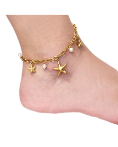TOBILLERA CON COLGANTES EN PERLAS Y ESTRELLAS DE MAR ACERO DORADO